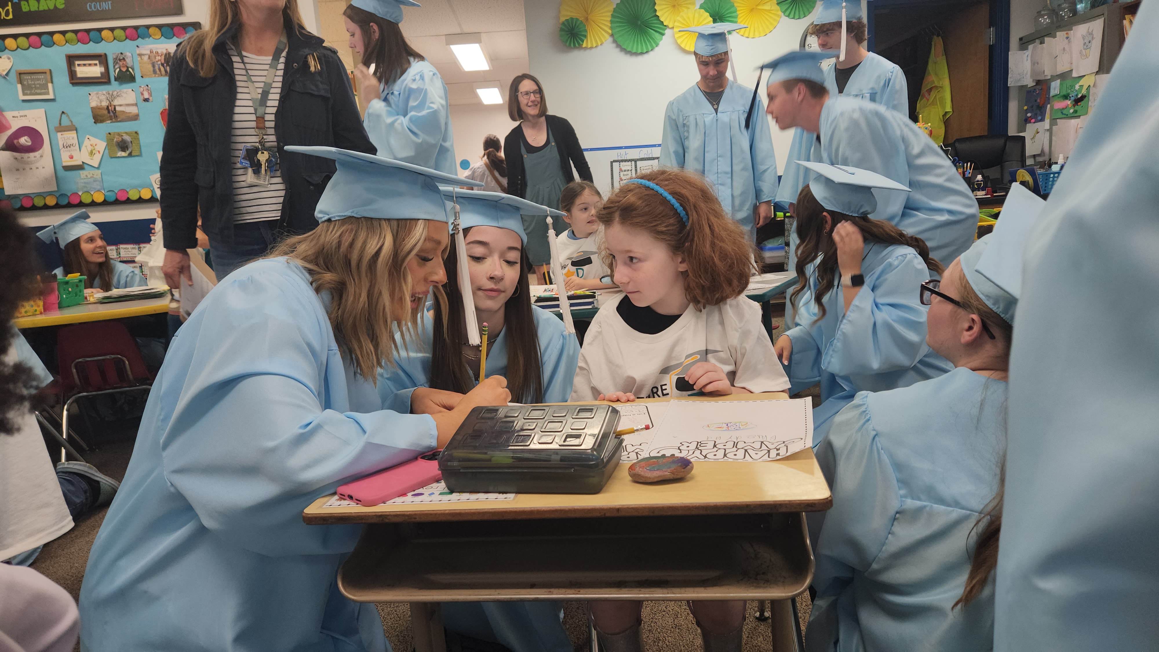 Great Falls High graduates talk with kindergartners