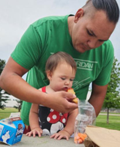 Teddie Lopez and his three children enjoyed free healthy lunches, crafts and games in West Kiwanis Park, as part of the United Way funded Park Pals program.